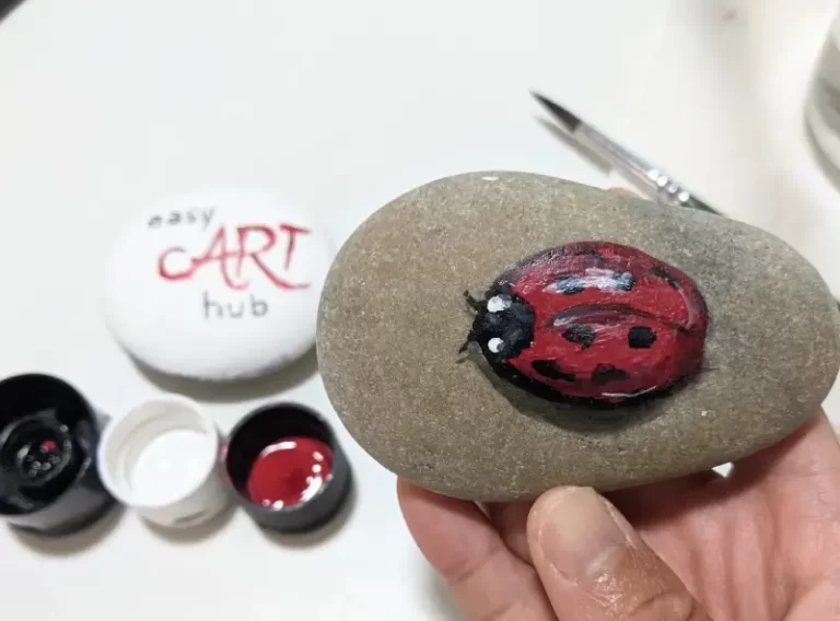 Realistic Ladybug Painted on a Rock