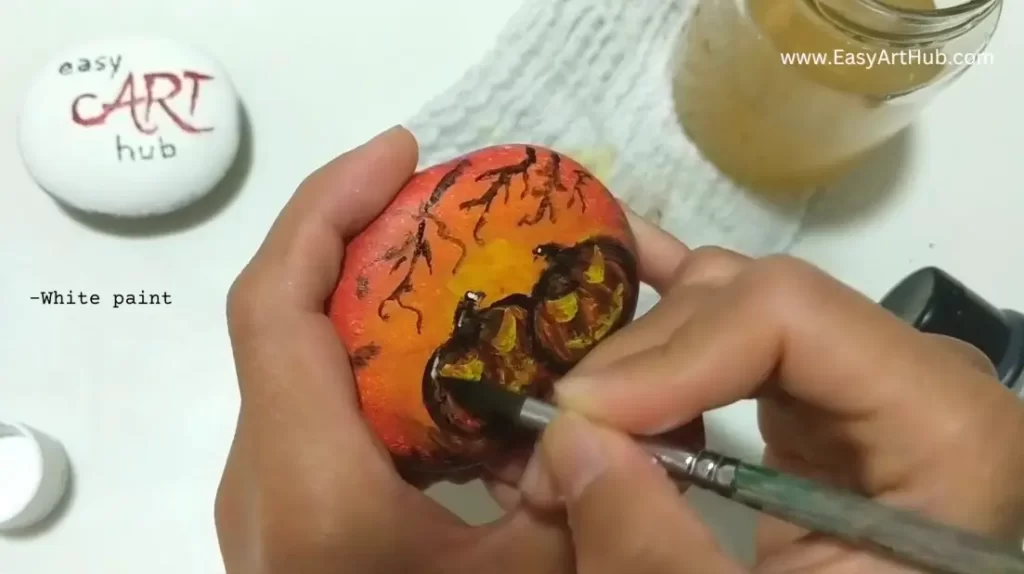 Step 5. Highlights (Halloween Pumpkin Rock Painting Tutorial)