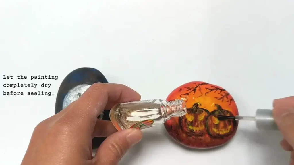 Step 6. Seal (Halloween Pumpkin Rock Painting Tutorial)