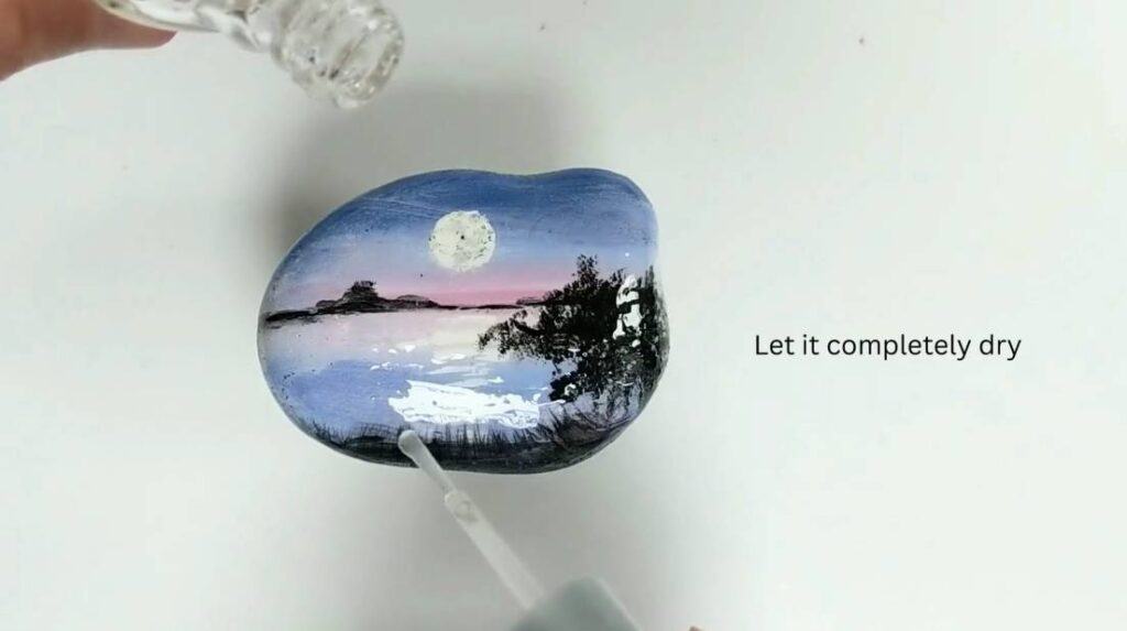 Step 7. Seal (Moonlit Landscape Rock Painting Tutorial)